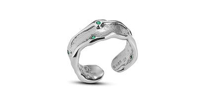A PART OF ME green crown punk ring featuring a unique twisted design with green gemstones