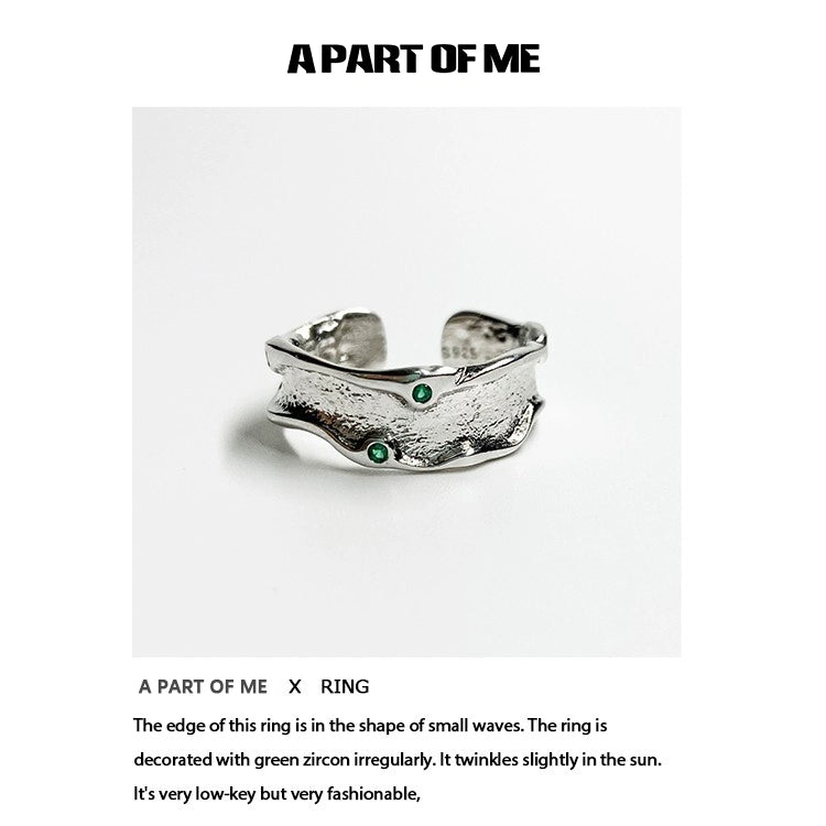 A Part of Me green crown punk ring featuring silver waves and sparkling green zircon accents