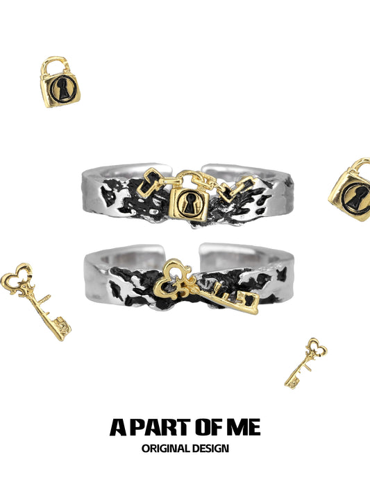 A PART OF ME hell lock ring featuring a unique design with key and padlock motifs in silver and gold