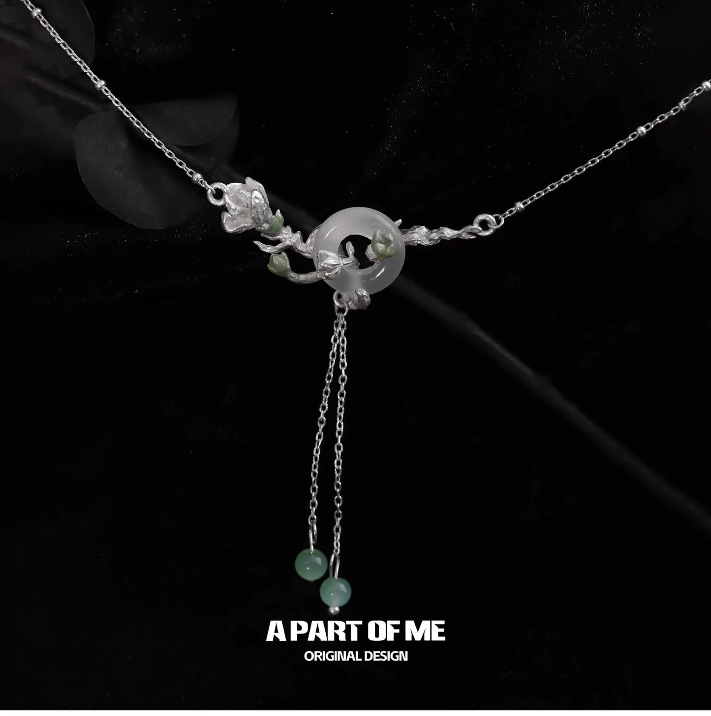 A delicate jasmine silver necklace featuring floral designs and adjustable chains for elegant styling