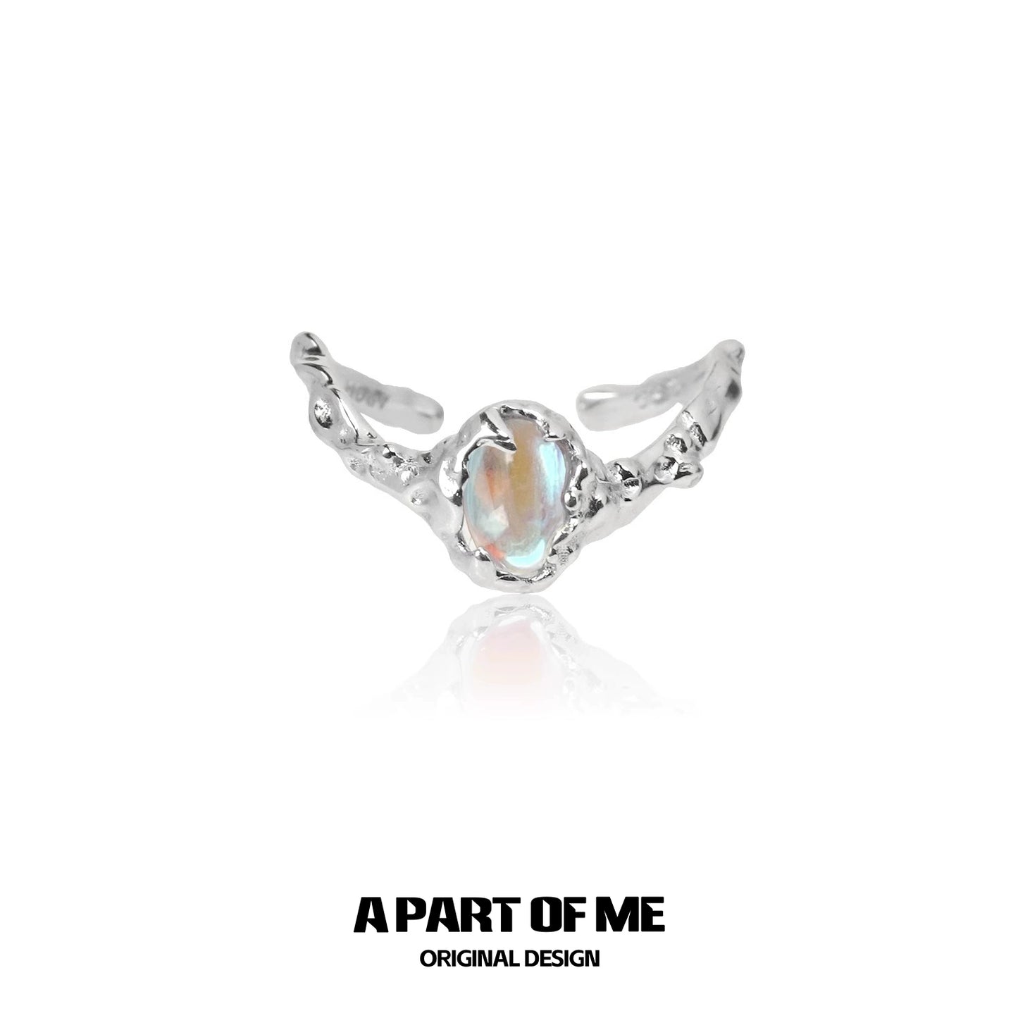A beautiful moonstone silver ring featuring intricate design and a sparkling gemstone, perfect for elegant fashion.