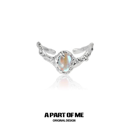 A beautiful moonstone silver ring featuring intricate design and a sparkling gemstone, perfect for elegant fashion.