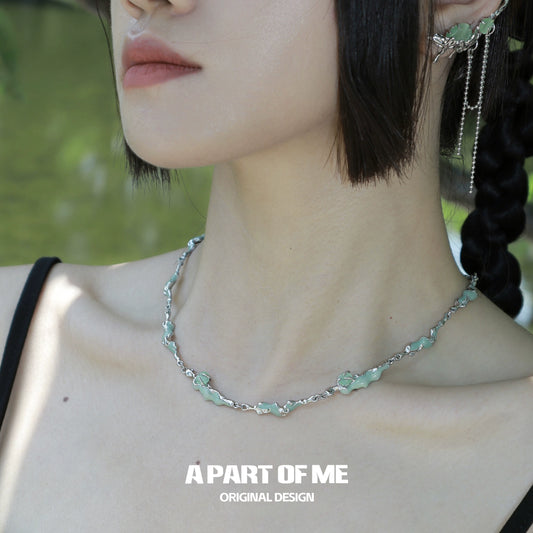A PART OF ME opal anchor necklace featuring a silver chain and delicate opal accents