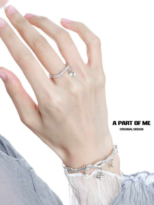 Elegant pearl elf silver ring displayed on a hand, showcasing unique design and shimmer
