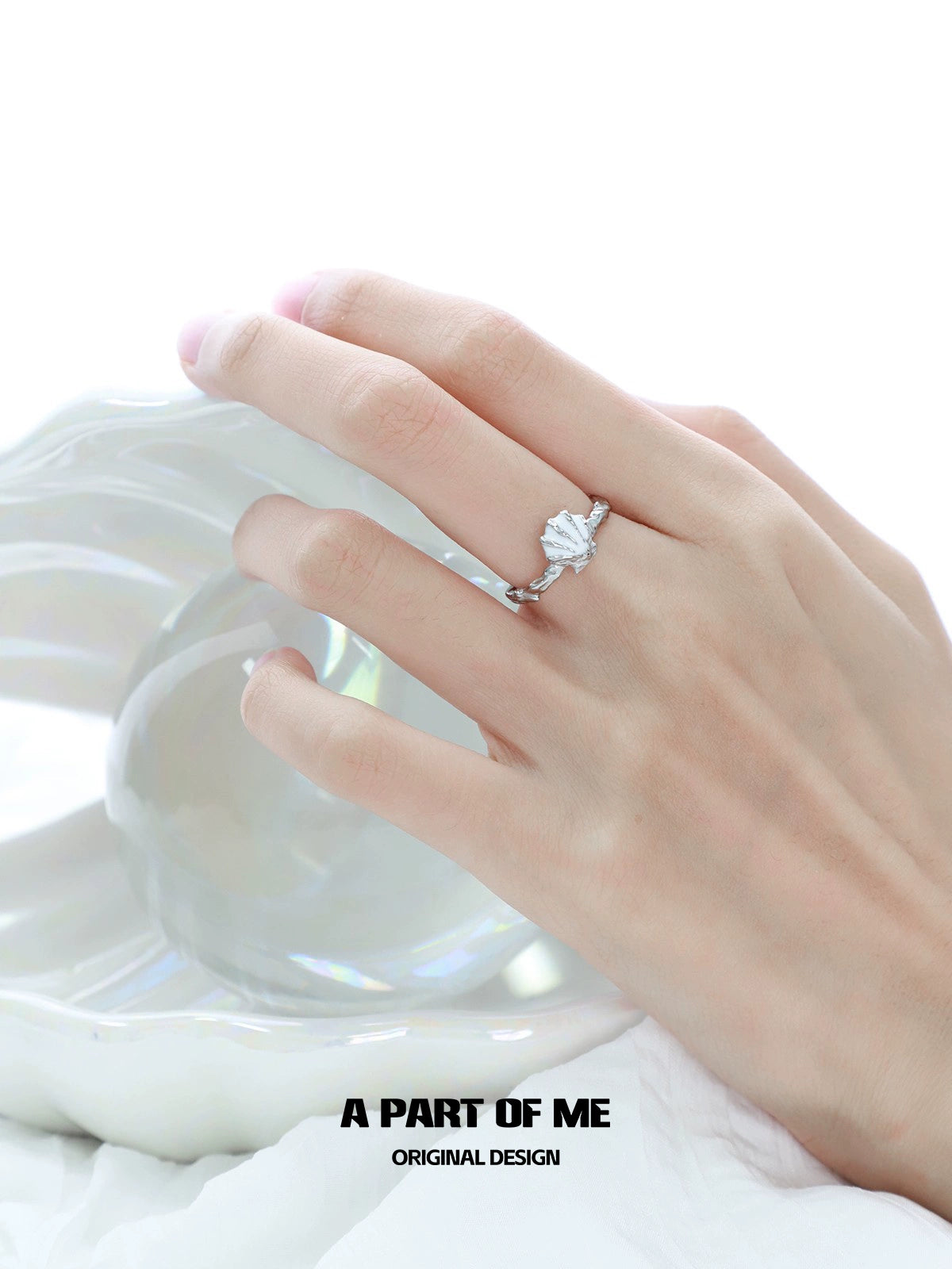 A Part of Me punk shell ring showcased on a hand with a delicate design and elegant finish