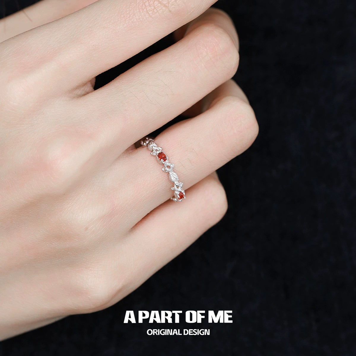 Elegant red candy ring with sparkling stones set in silver, perfect for stylish occasions