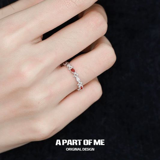 Elegant red candy ring with sparkling stones set in silver, perfect for stylish occasions