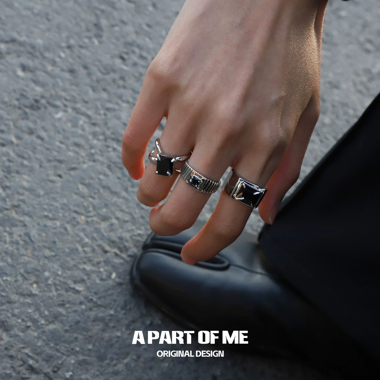 A PART OF ME savage claw hip-hop ring displayed on a stylish hand with silver accents