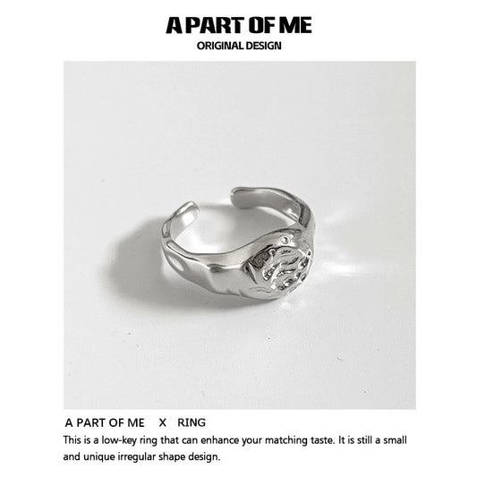 A unique silver A PART OF ME self-love ring for women with an irregular shape design