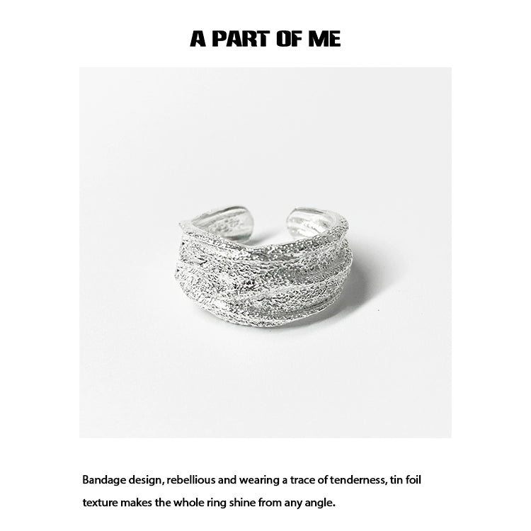 Silver bandage ring featuring a unique tin foil texture for a stylish and rebellious look