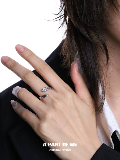 Elegant snake diamond silver ring showcased on a hand with stylish attire