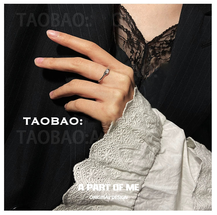 Elegant hand wearing a starry dream romantic ring, showcasing its delicate design