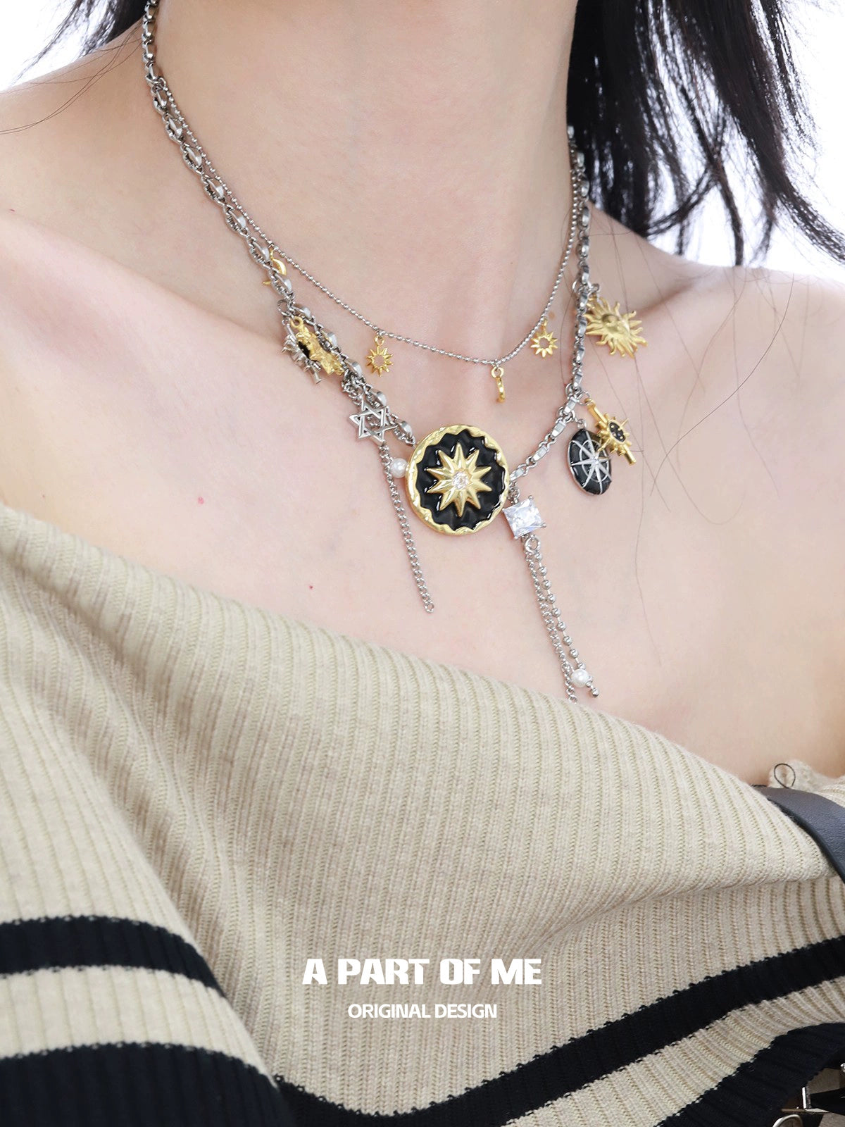 Layered silver sun and moon necklace featuring celestial charms and star details for a stylish look