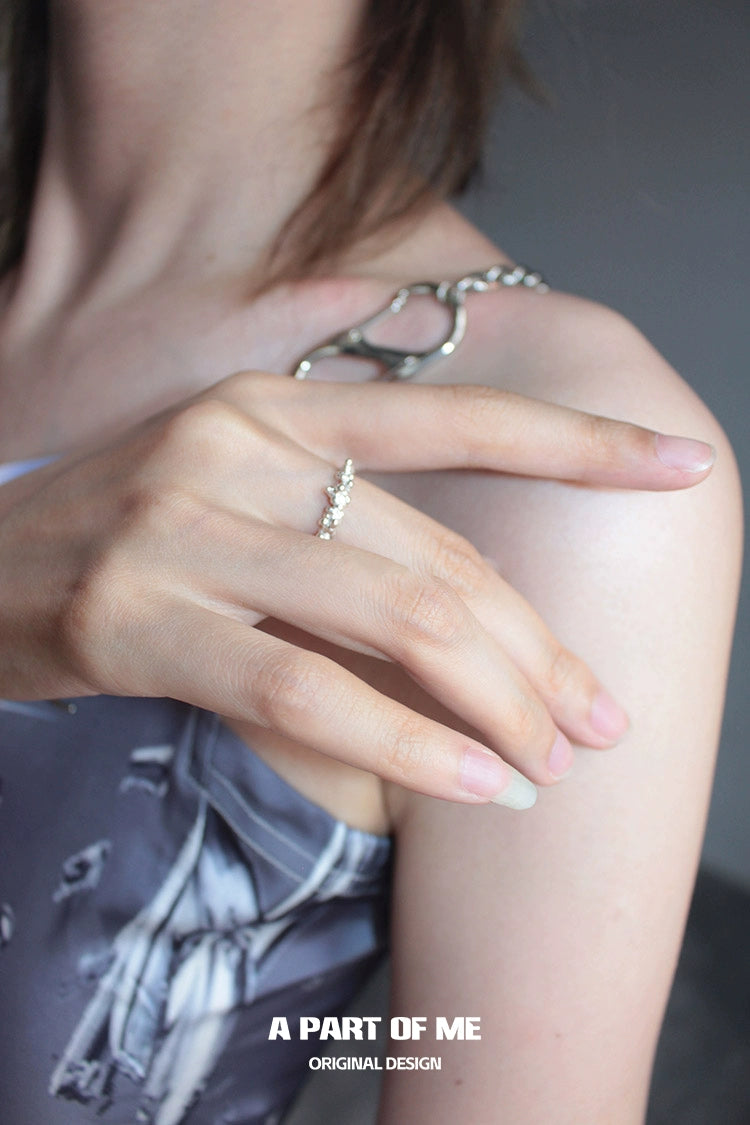 A woman's hand showcasing a delicate A PART OF ME surf texture couple rings on her finger