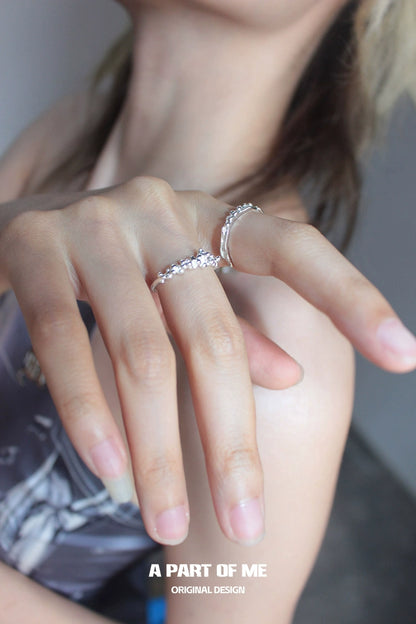Stylish surf texture couple rings in silver worn on fingers for a trendy look