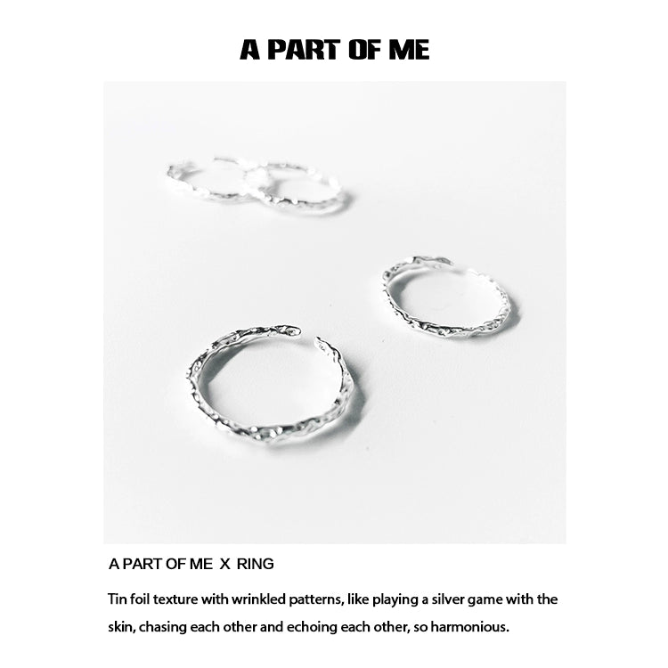 Textured silver rings with wrinkled patterns, showcasing a unique and harmonious design