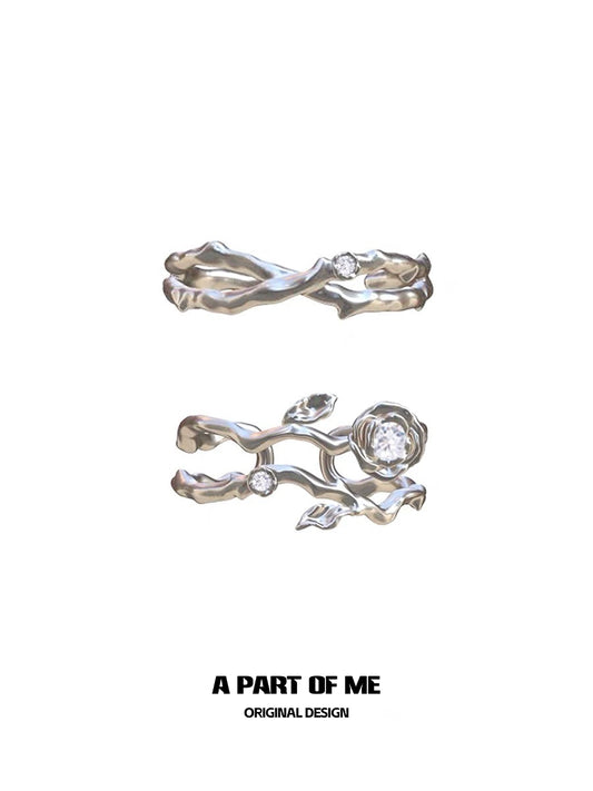 Thorned rose silver ring featuring intricate floral design and sparkling gemstones