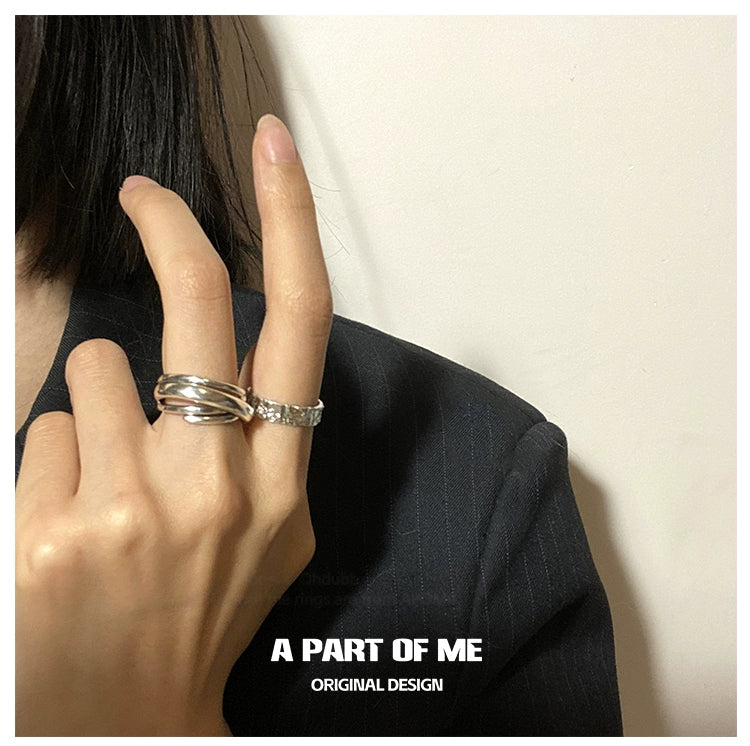 Stylish tinfoil crinkle punk ring worn on a finger, showcasing an original design by A PART OF ME