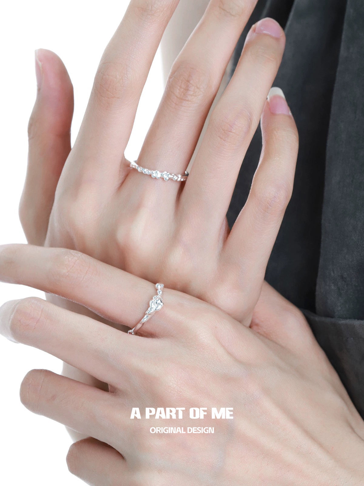Two stylish rings displayed on hands featuring a unique silver textured ring for elegant fashion.