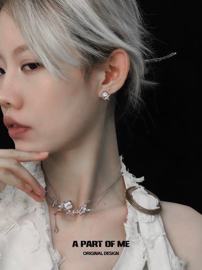 Model wearing a white butterfly shell necklace paired with elegant earrings for a stylish look
