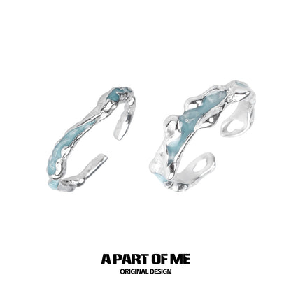 A PART OF ME white orchid love ring featuring a unique silver design with blue accents