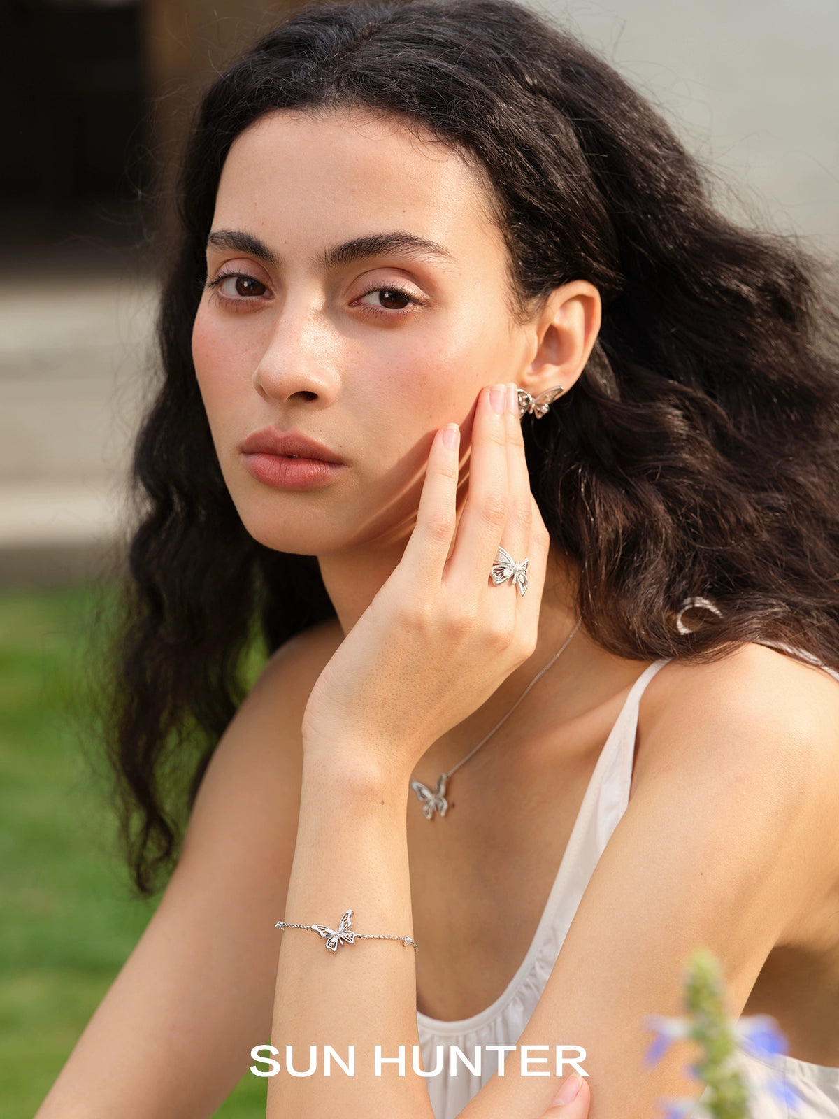 SUN HUNTER Angel Butterfly Ring in Silver, beautifully worn on a model's hand