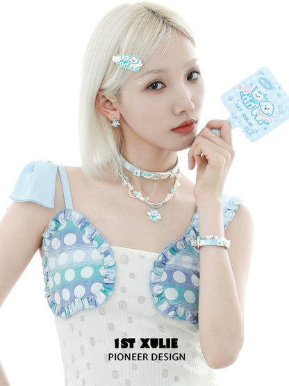 Model showcasing the 1ST XULIE angel cat and puppy necklace with colorful pastel accessories