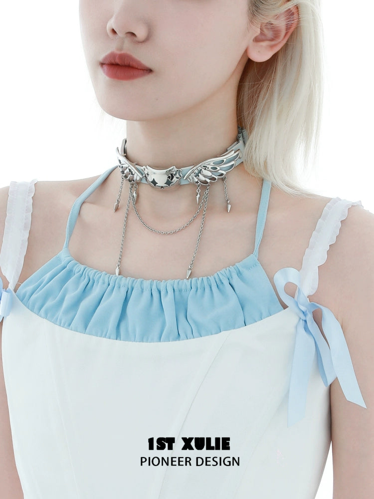 Stylish angel cat necklace by 1ST XULIE worn with a light blue top, showcasing a unique design