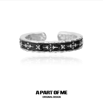 A PART OF ME black star cluster ring in silver with intricate design and unique detailing