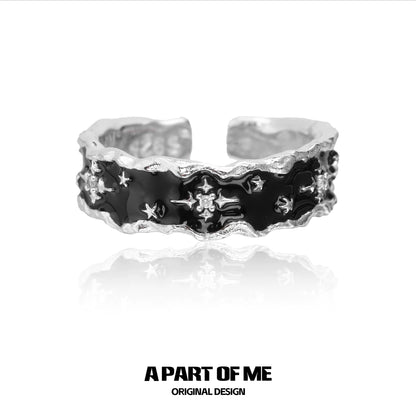A PART OF ME black star cluster ring with a textured silver band featuring black star detailing