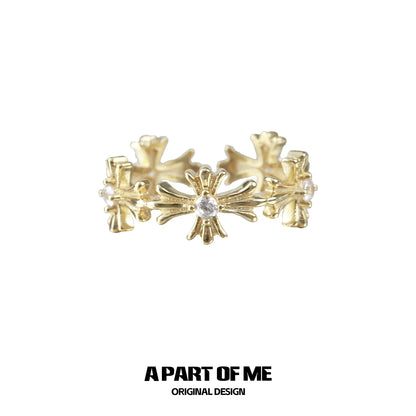 A PART OF ME Gold Cross Couple Rings with Intricate Floral Design and Center Gemstone
