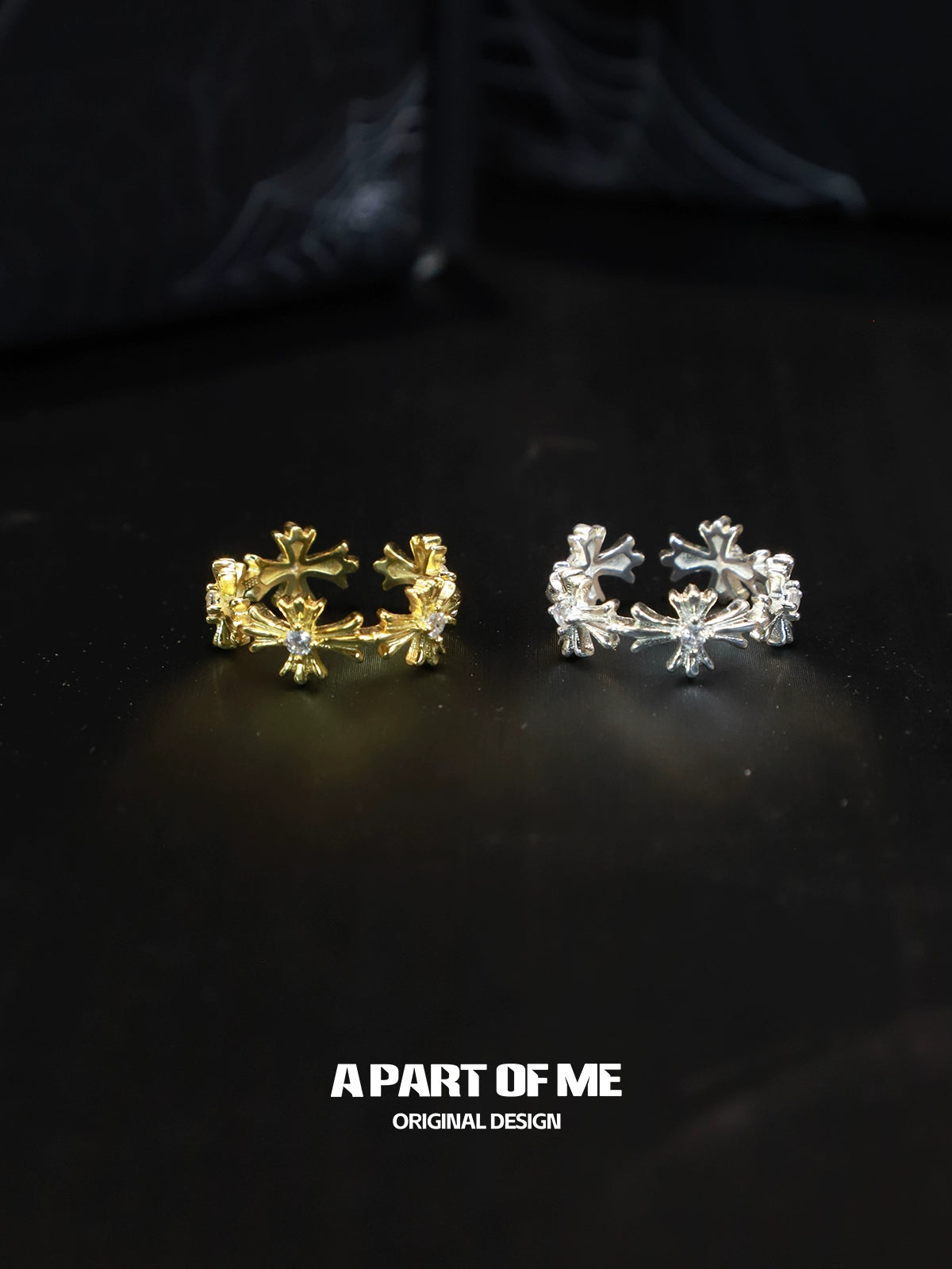 A PART OF ME cross couple rings in gold and silver featuring intricate designs with sparkling stones