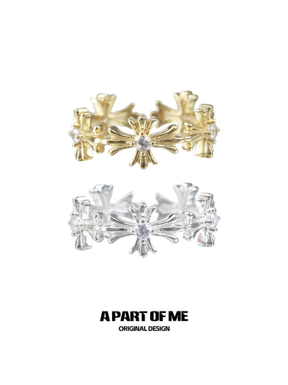 Elegant A PART OF ME cross couple rings in gold and silver, featuring intricate floral designs.