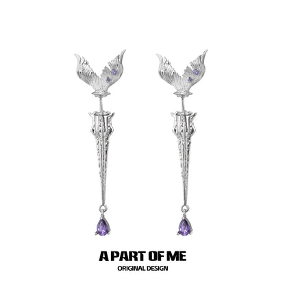 A PART OF ME fishtail dart sword earrings featuring intricate design and amethyst accents