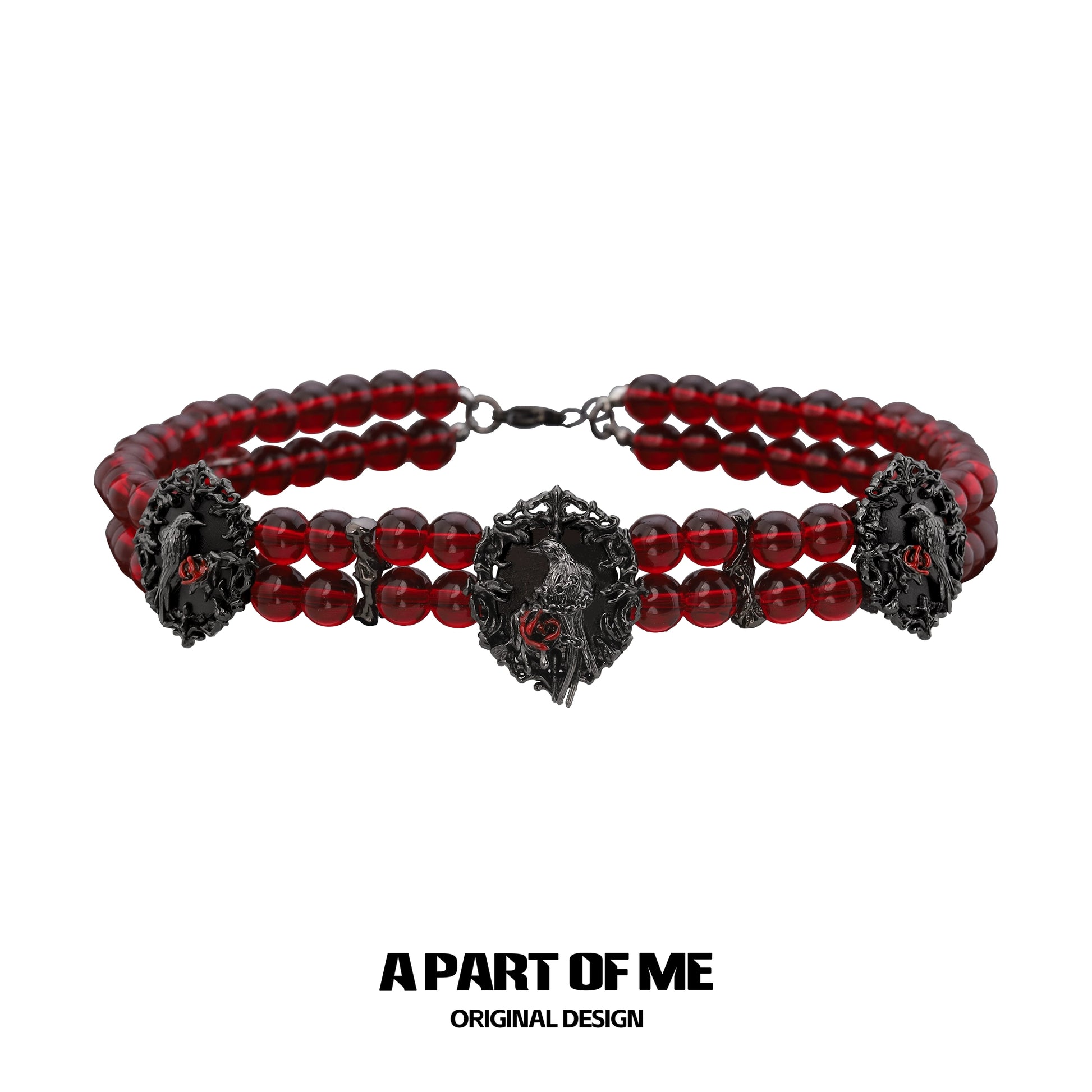 Gothic raven necklace featuring red beads and intricate raven designs for a bold accessory