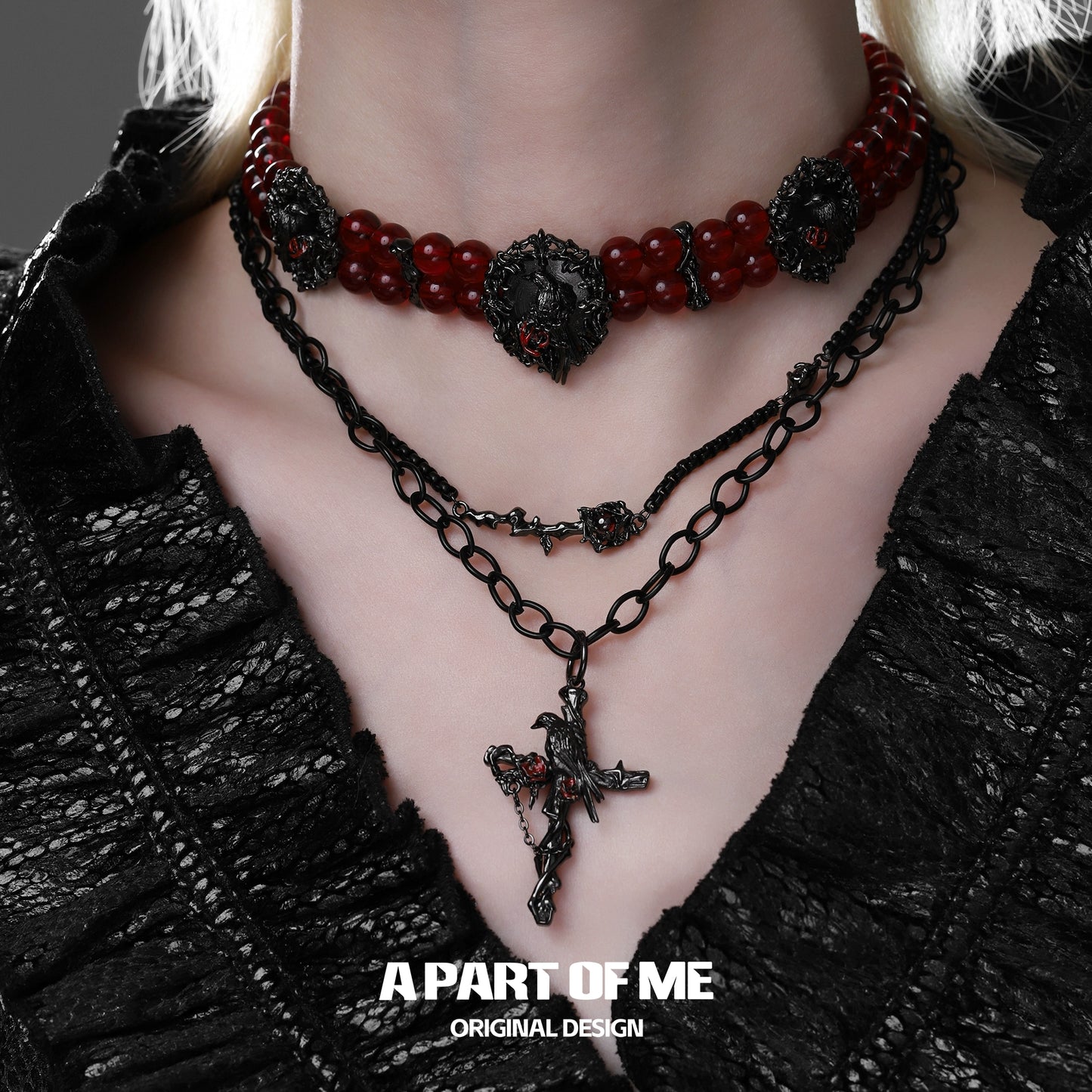 A PART OF ME gothic raven necklace layered with red bead accents for a stylish edgy look