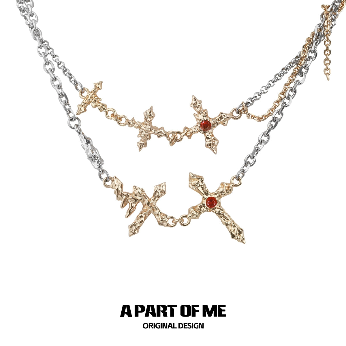 A PART OF ME liquid metal cross necklace featuring unique cross designs and red accents