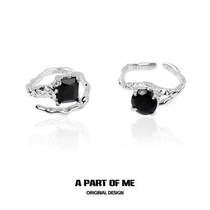 Midnight gem couple rings in silver with unique twisted design and black gemstones