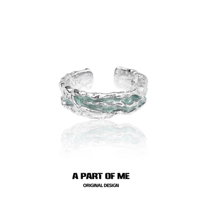 Mint silver ring by A PART OF ME featuring a textured design and unique color accents