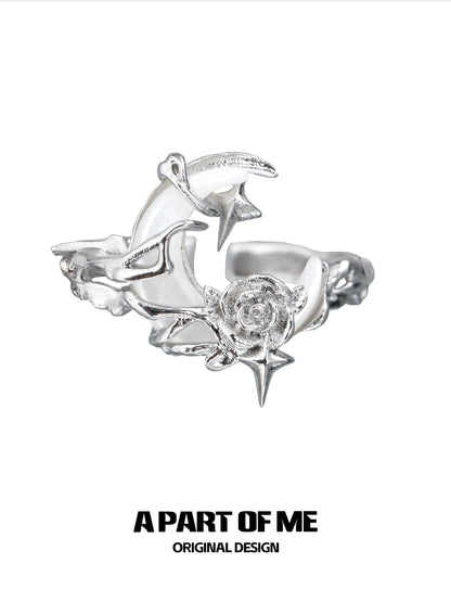 A beautiful moonlight rose silver ring featuring intricate star and rose designs