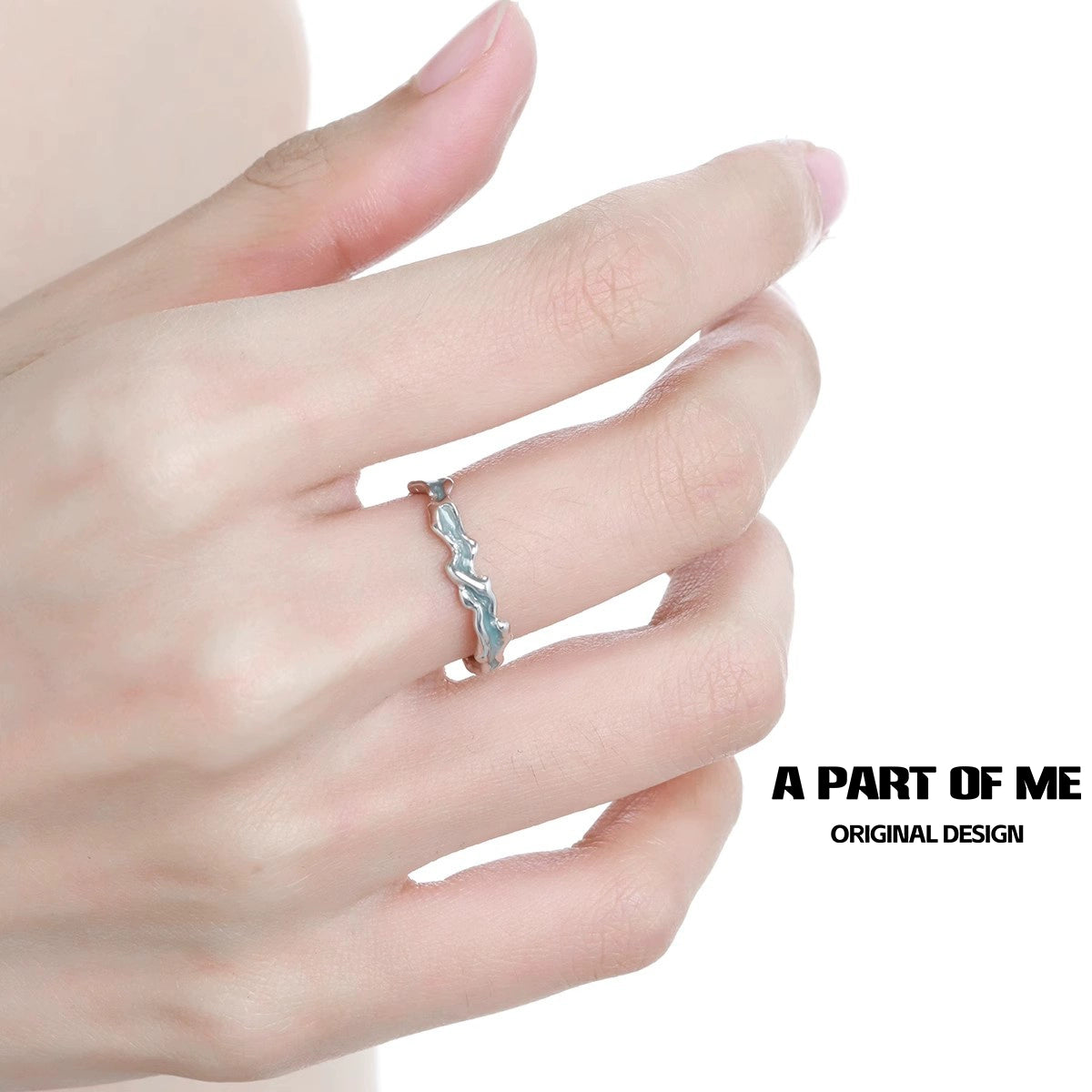Stylish tidal wave ring showcased on a finger, featuring a unique wavy design for a trendy look