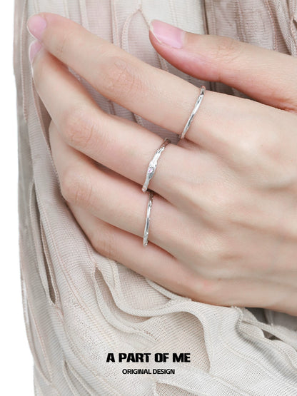 Elegant silver rings displayed on a hand showcasing ultra-fine zircon pair rings for stylish accessories