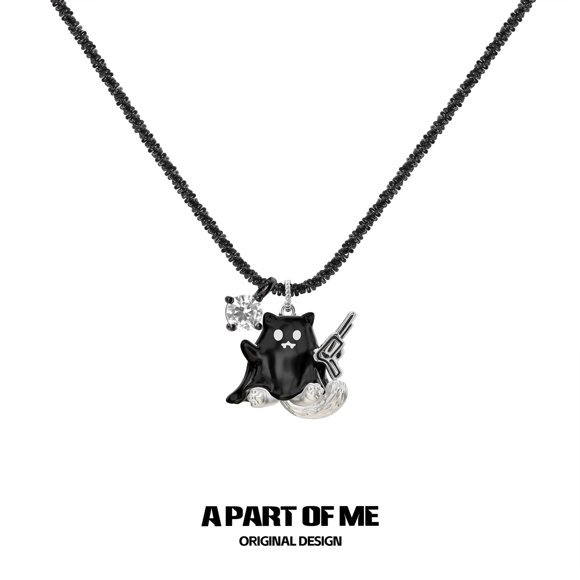 Weapon kitten devil necklace by A PART OF ME featuring a black kitten charm with a gun and sparkling detail