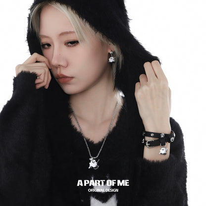 A PART OF ME weapon kitten devil necklace showcasing a playful design on a model wearing a cozy black hoodie