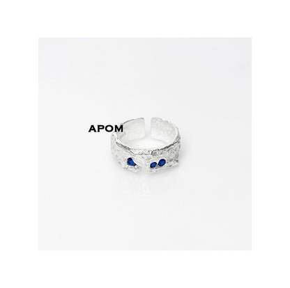 Stylish blue gemstone silver ring featuring a textured design and adjustable fit