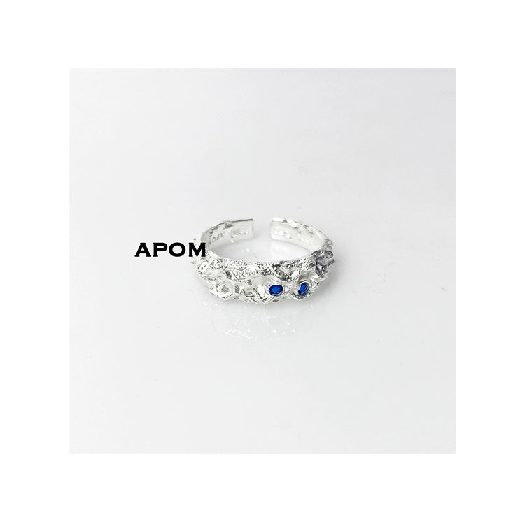 A Part of Me blue gemstone silver ring with intricate design and two blue stones