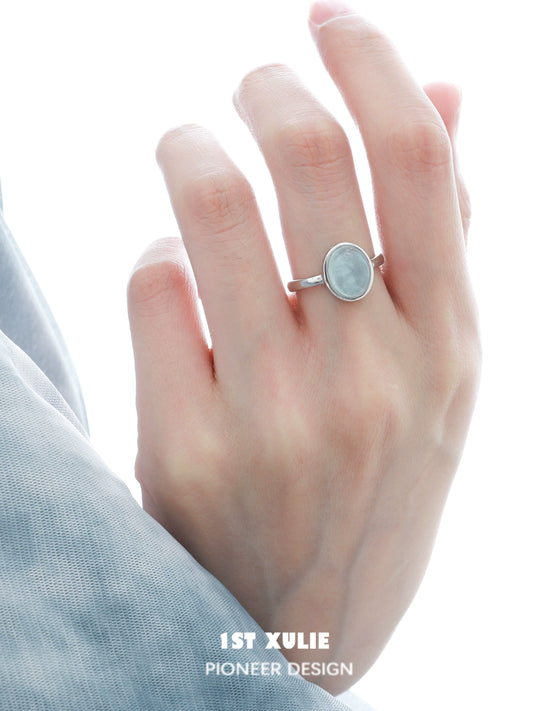 Elegant aquamarine silver ring displayed on a hand with a minimalist design for timeless beauty