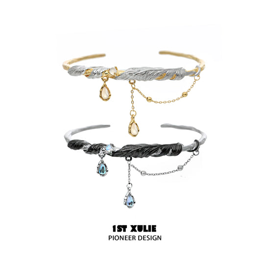 Black and gold feather couple bracelet featuring an elegant twisted design and dangling charms