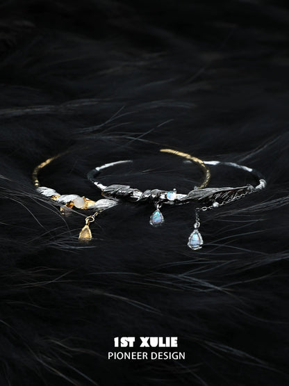 Black and gold feather couple bracelet with delicate design and sparkling charms for couples