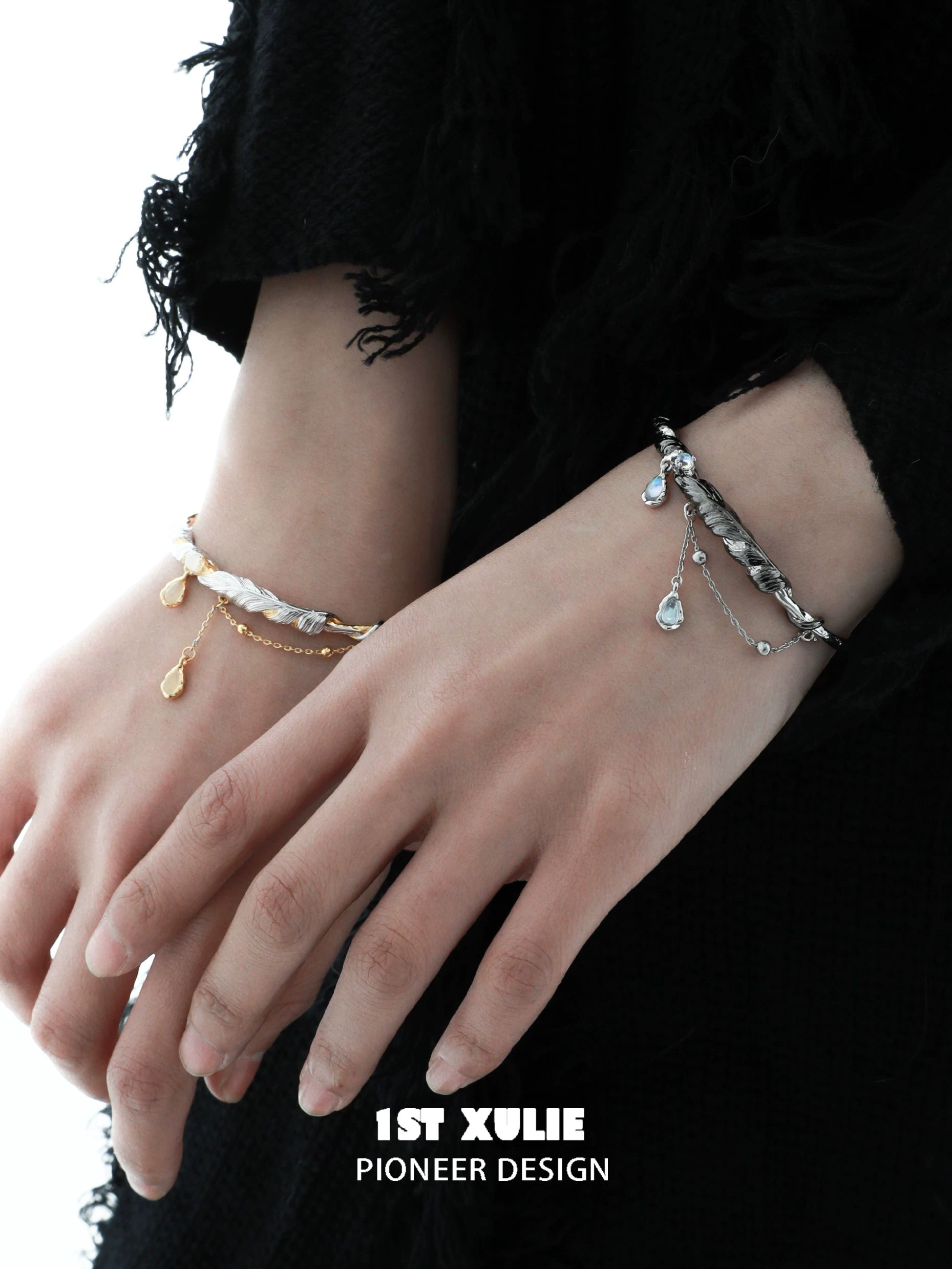 Stylish black and gold feather couple bracelet showcased on hands with elegant design.